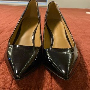 Patent black size 7 pumps by 14th & Union; excellent condition.